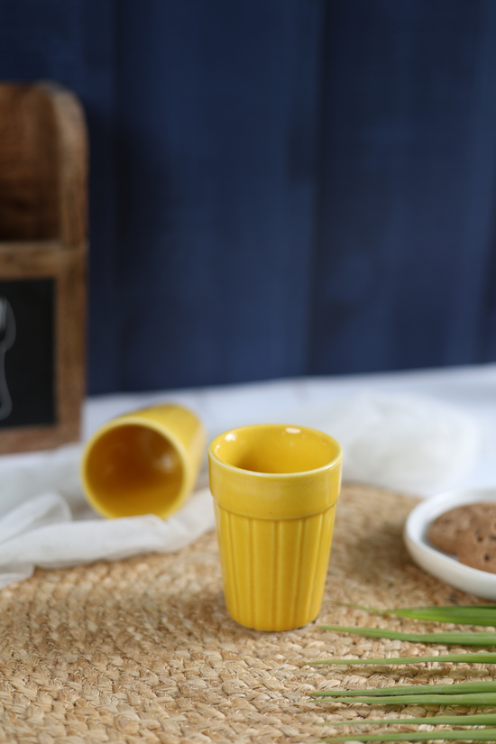 Two handmade yellow kulhads 