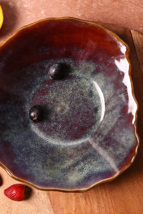 Olive mistif bowl on wooden surface 
