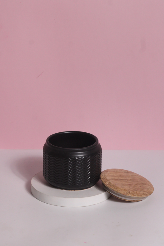 Black airtight storage jar with open lid