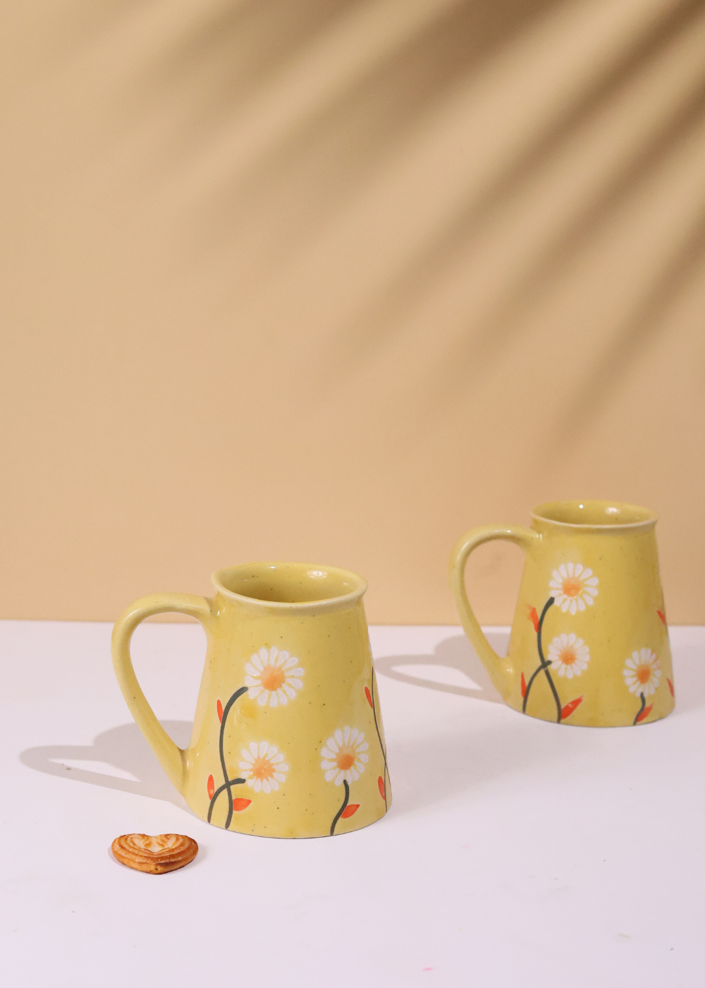 Two handmade ceramic coffee mugs 