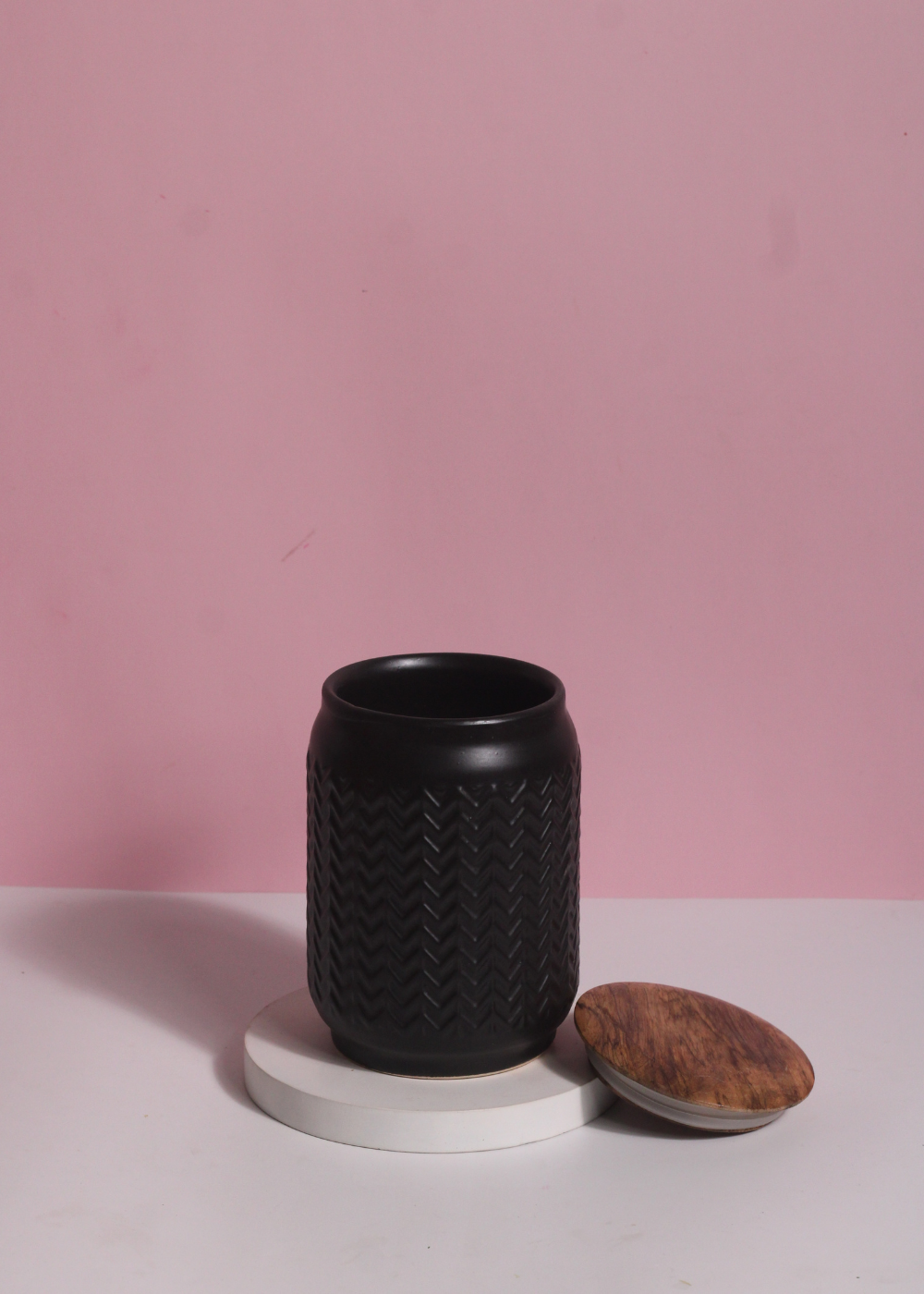 Black storage jar with wooden lid 