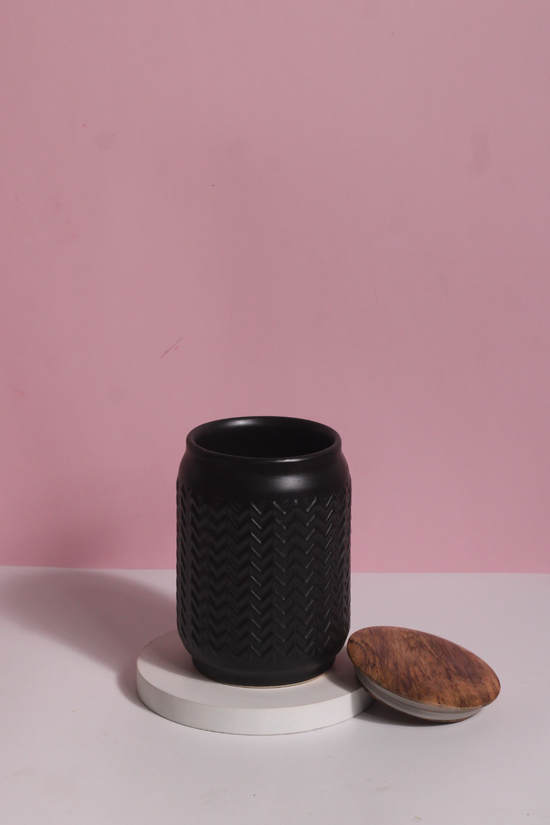 Black storage jar with wooden lid 