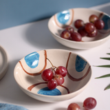 Blue and brown ring bowls with grapes