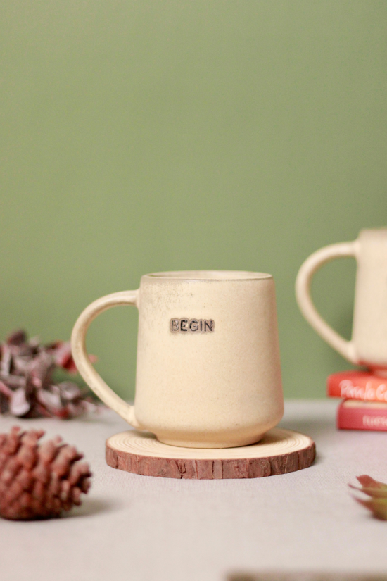 Begin coffee mug on wooden surface 