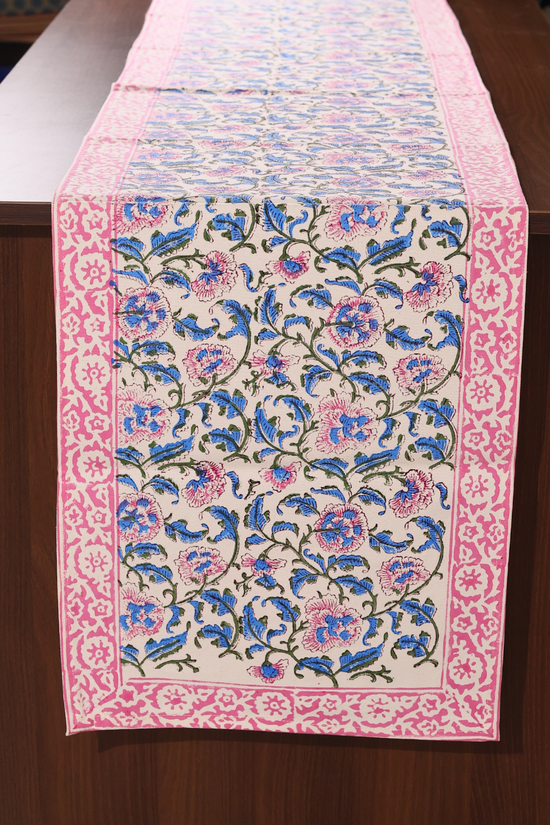 Blue & pink floral table runner on a wooden table
