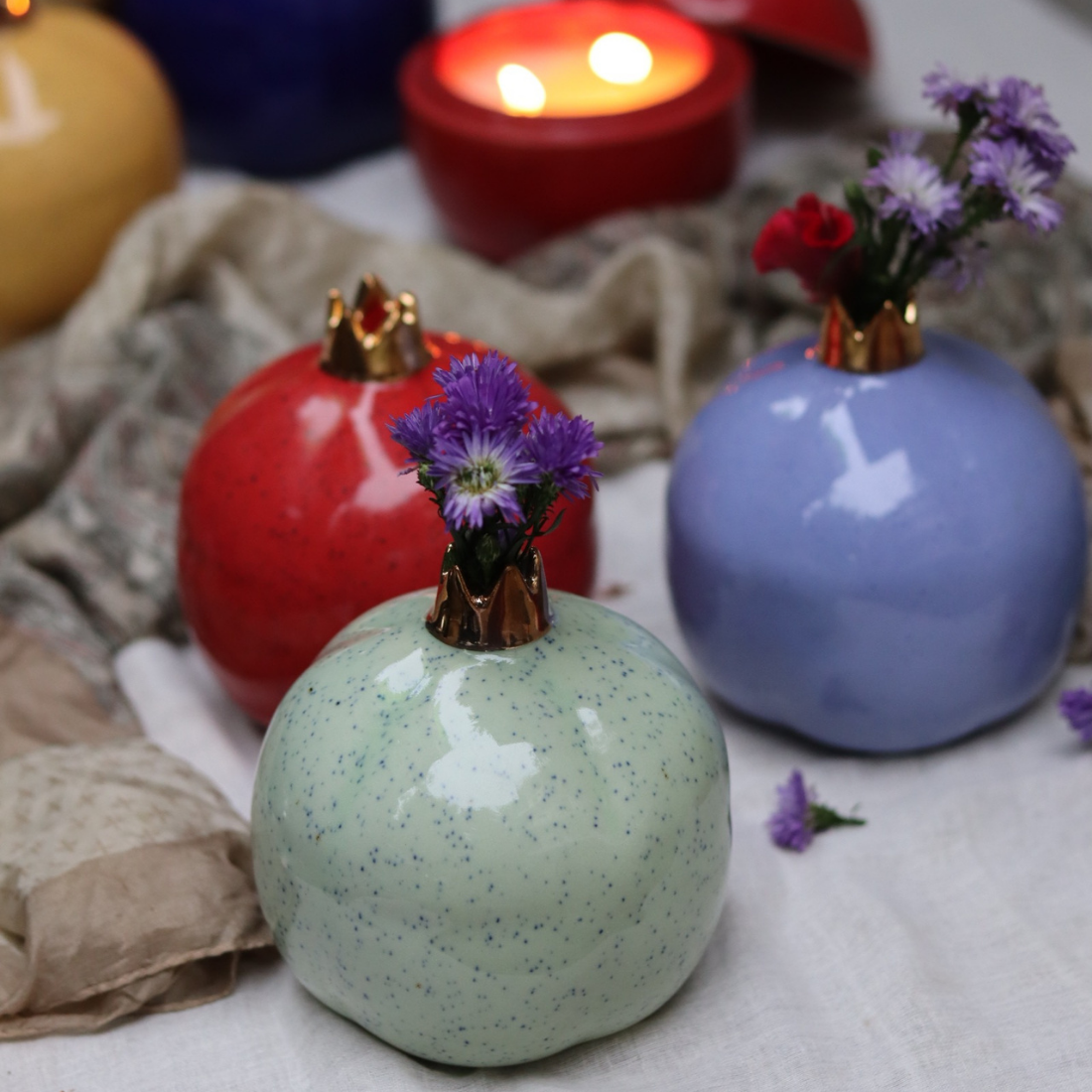 Three anar vases with flowers different colors