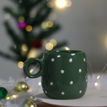 Handmade ceramic coffee mug with decorations