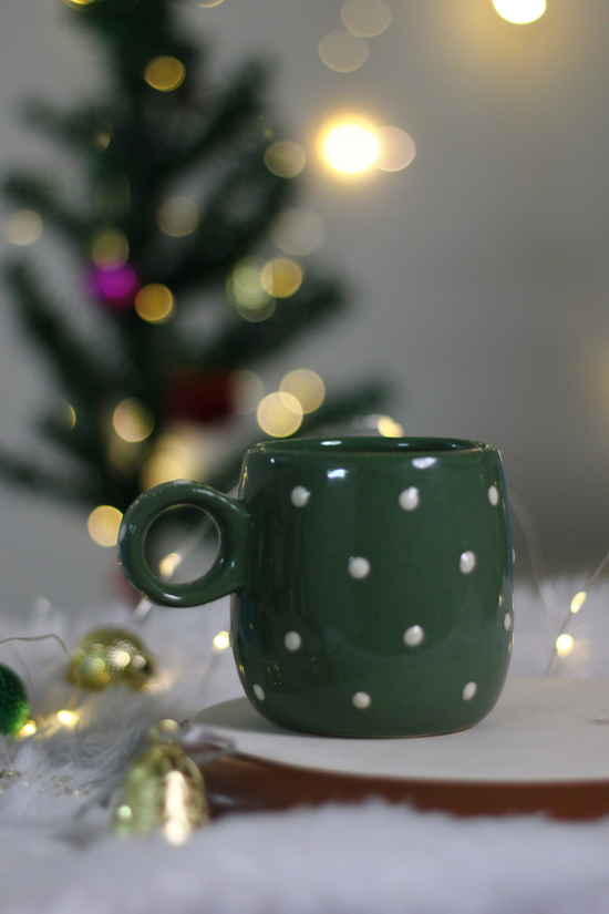 Handmade ceramic coffee mug with decorations