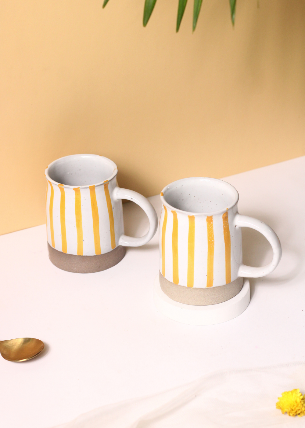 Yellow striped ceramic coffee mugs 