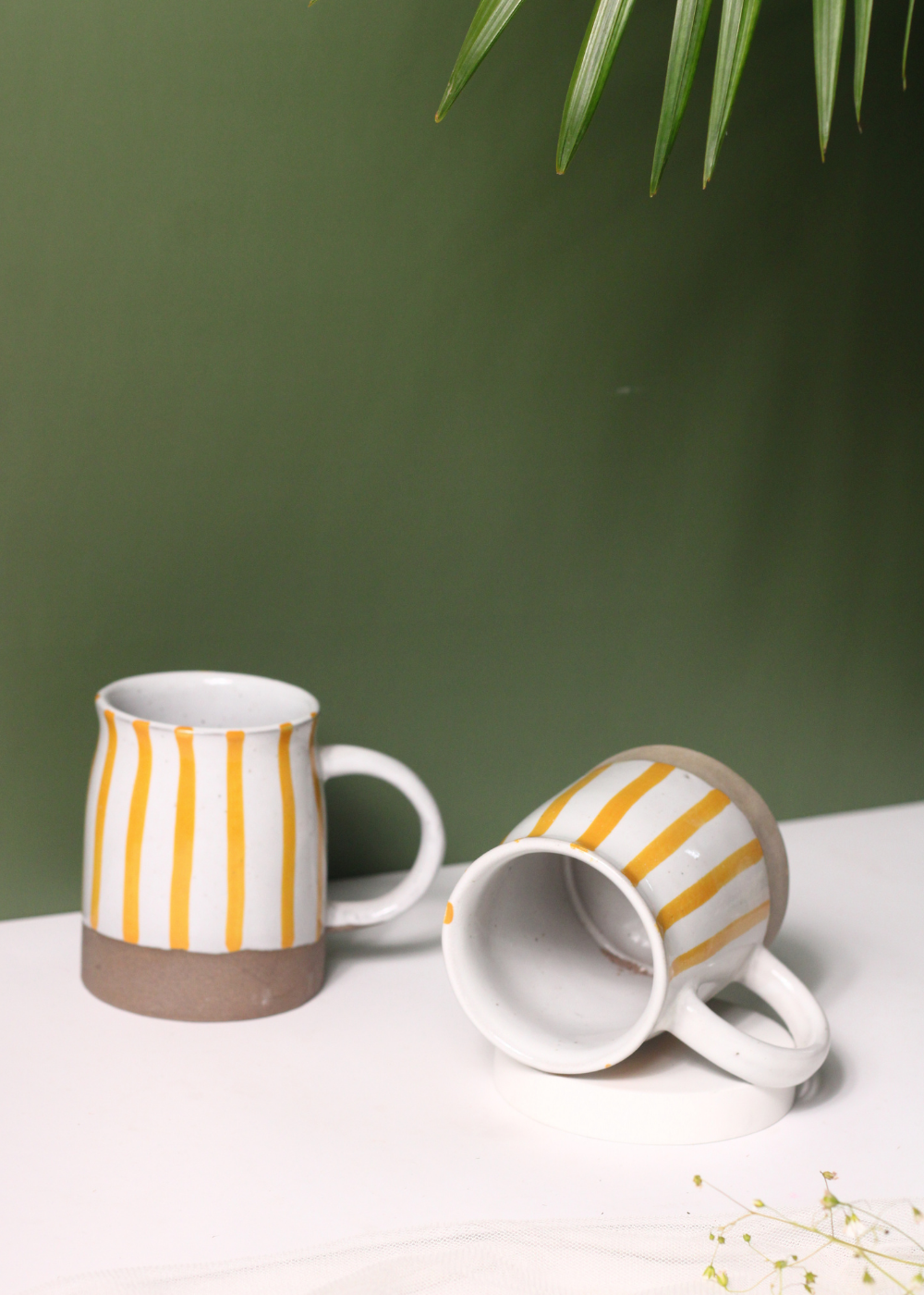 Handmade ceramic yellow striped coffee mugs 