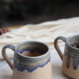 Brown and blue drip coffee mug round