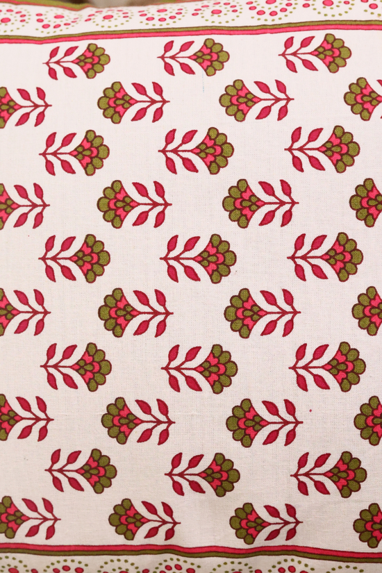 Closeup shot of pink & green motifs cushions