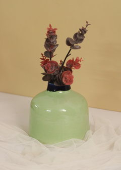 Green round vase with flowers