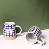 Two ceramic coffee mugs