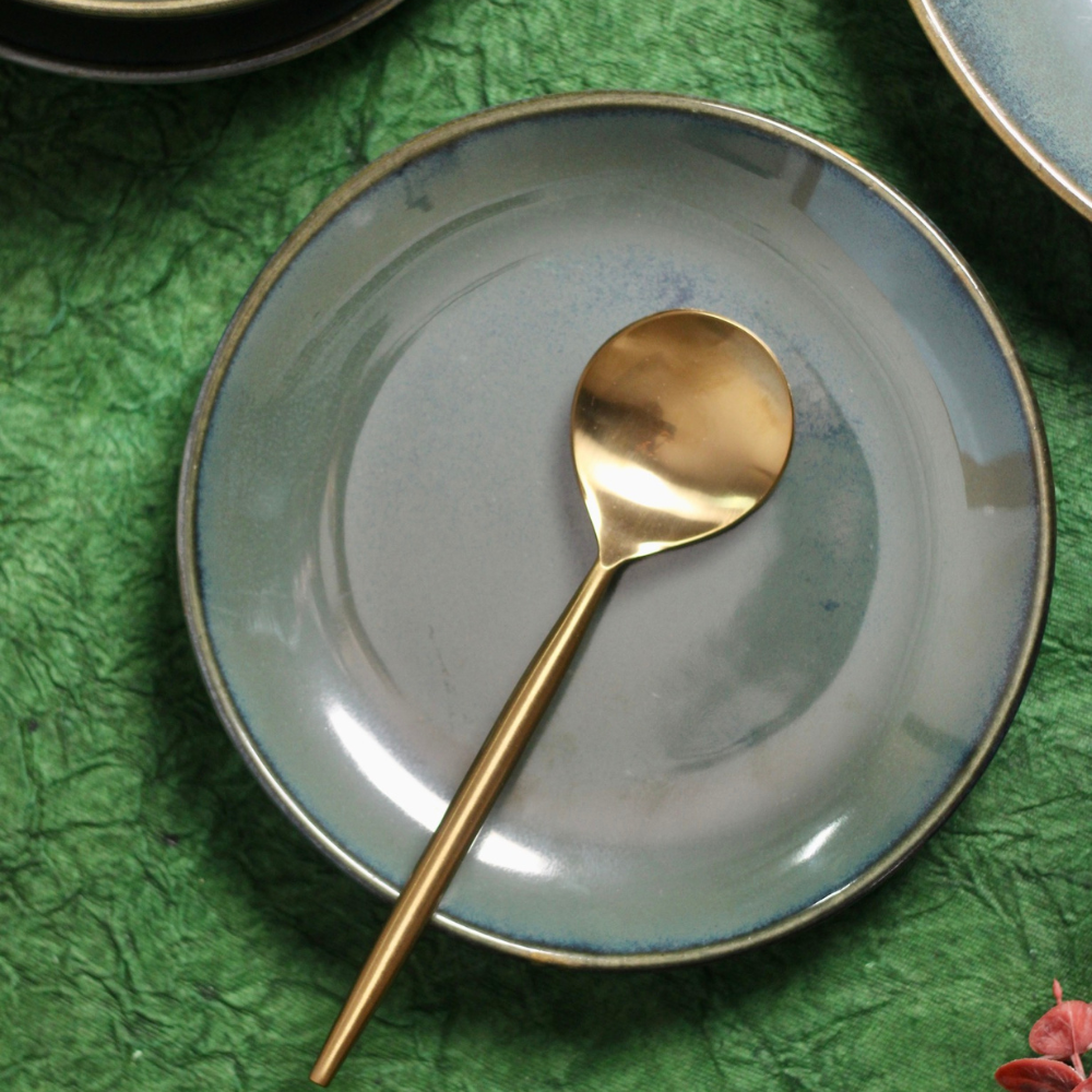 Metallic green quarter plate with spoon