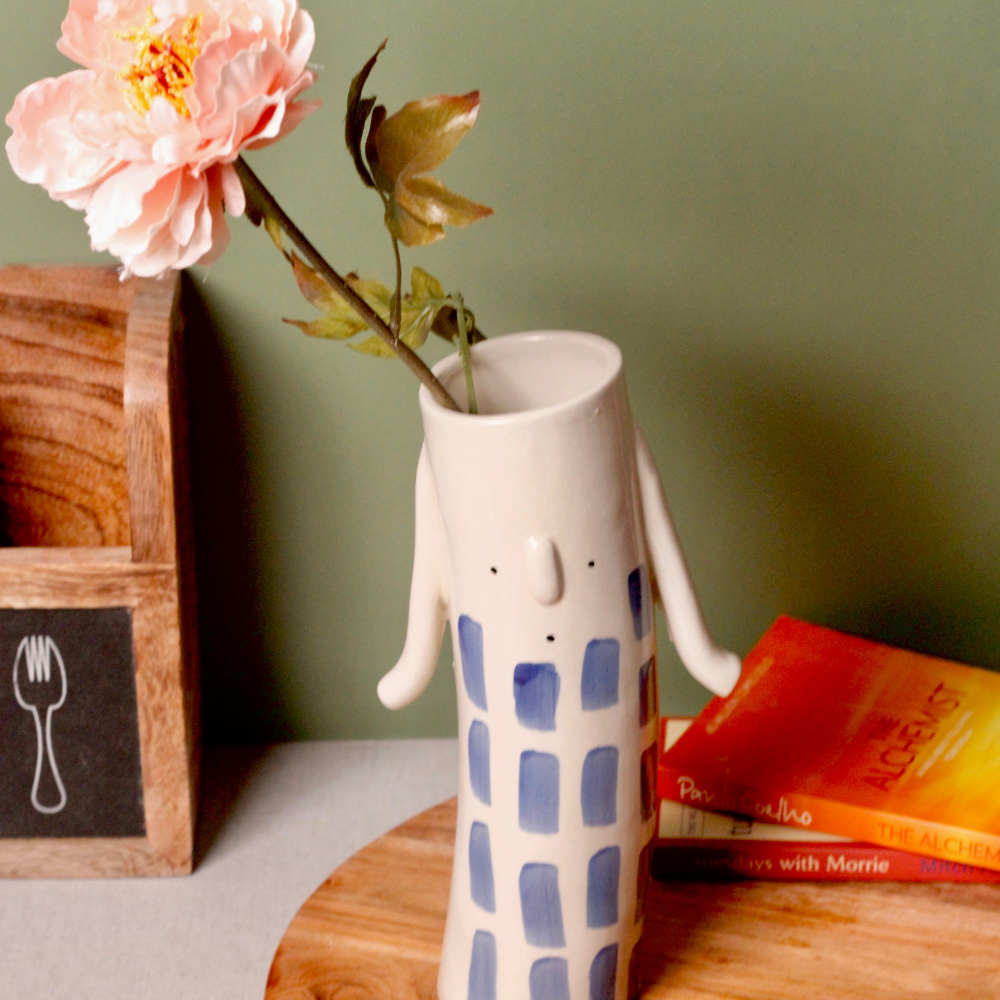 Flower vase with flowers on wooden 