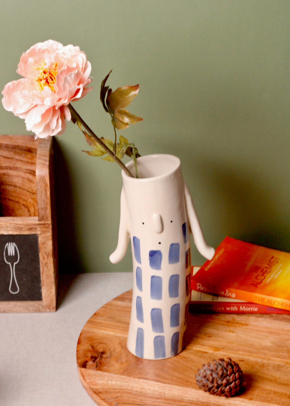 Flower vase with flowers on wooden 