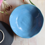 Blue handmade bowl with flower
