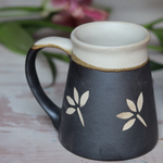 black and white ceramic coffee mug