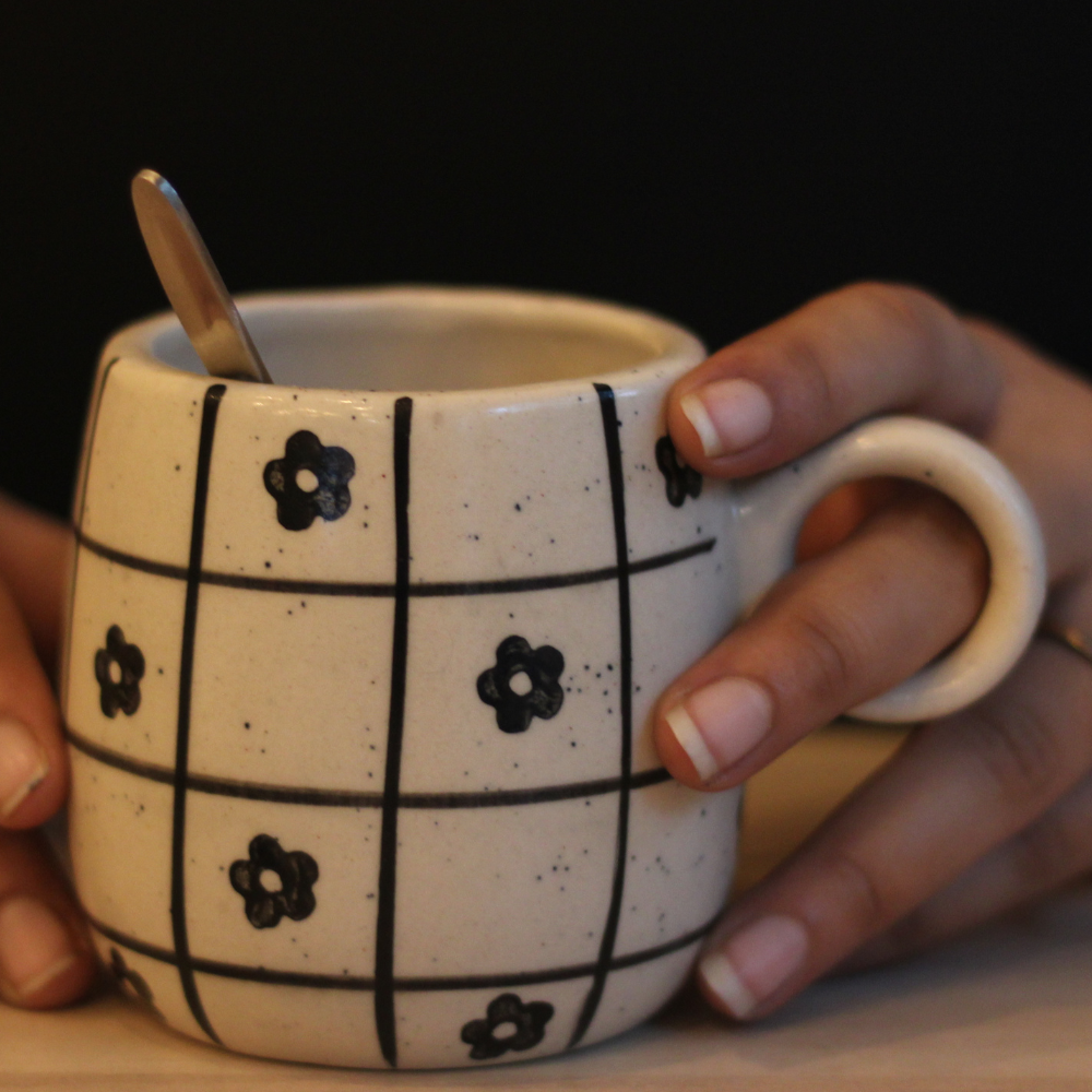 Floral chequered cuddle mug in hand