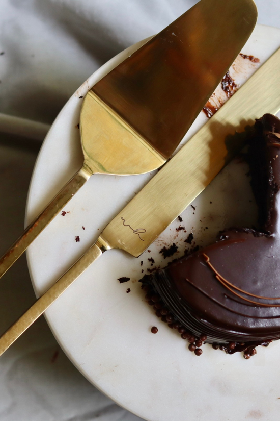 Gold cake cutter & server with cake