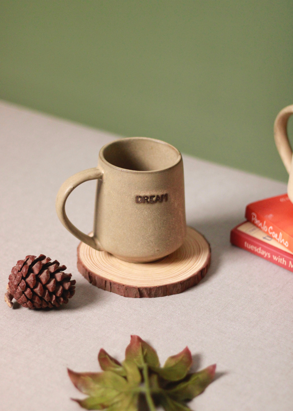 Dream coffee mug on wooden coaster
