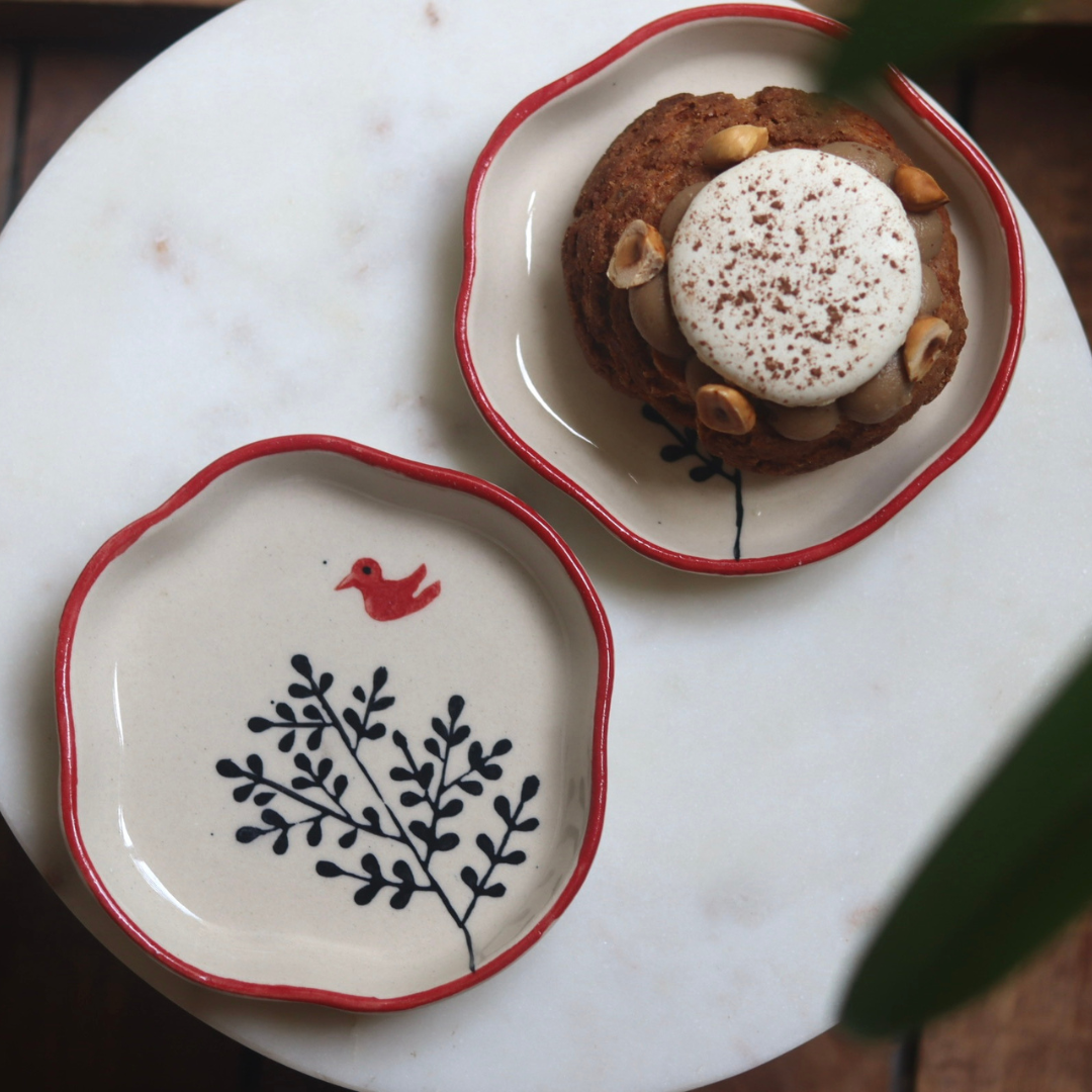 Birdie handmade dessert plate one having dessert on it