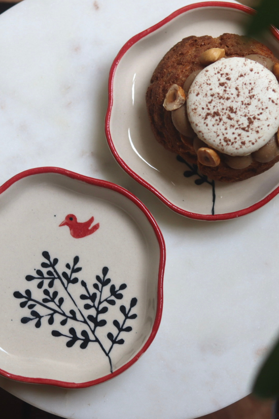 Birdie handmade dessert plate one having dessert on it