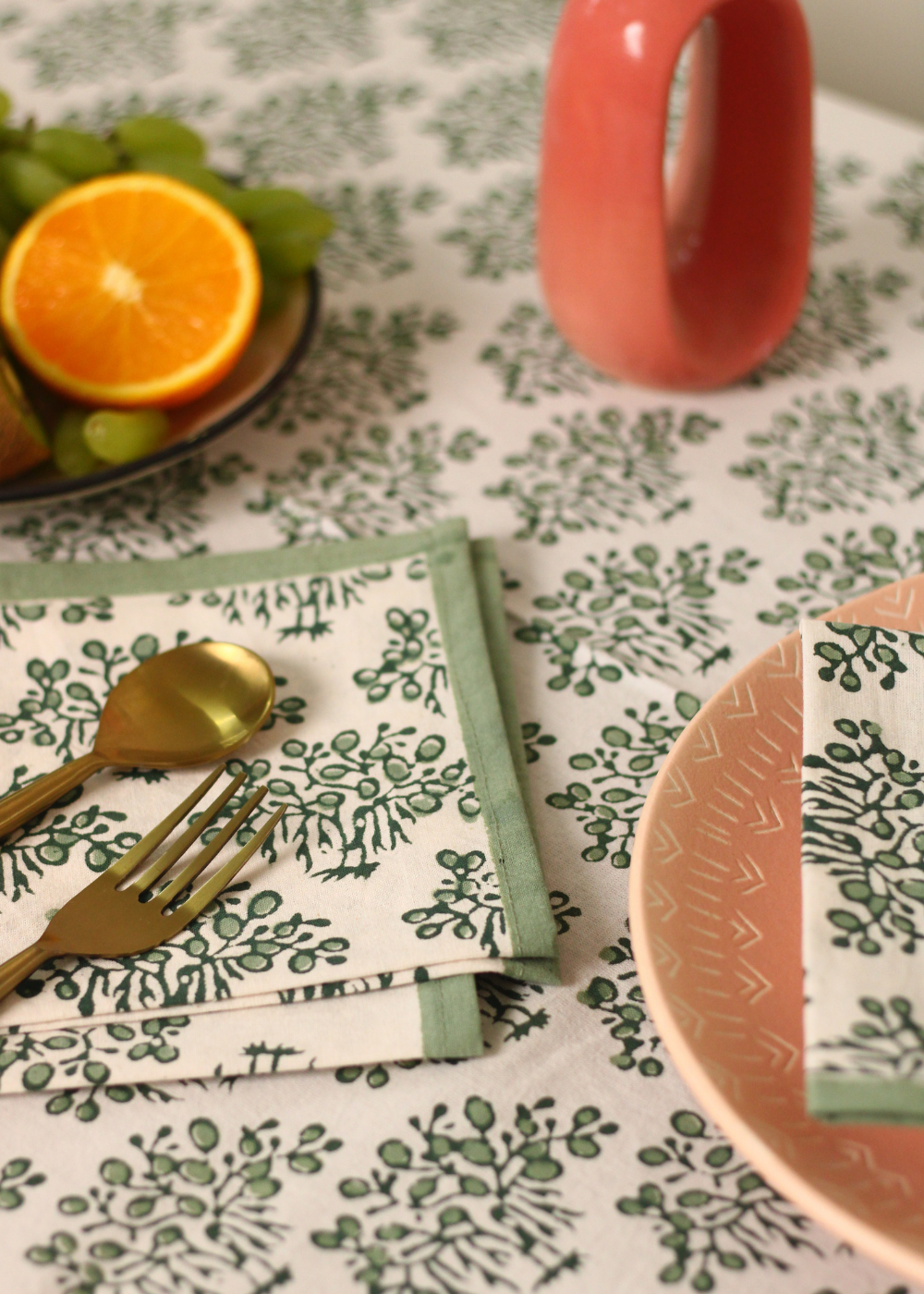 Closeup shot of table napkin with cutlery and fruits