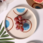 Blue and brown ring platter with fruits