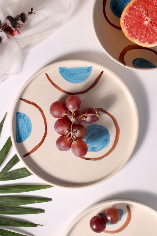 Blue and brown ring platter with fruits