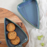 Handmade ceramic blue leaf bowls with biscuits