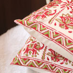 Two red elephant print cushions 