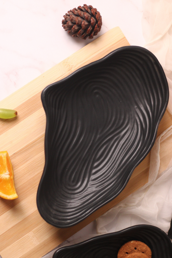 Black mistif bowl on a wooden surface