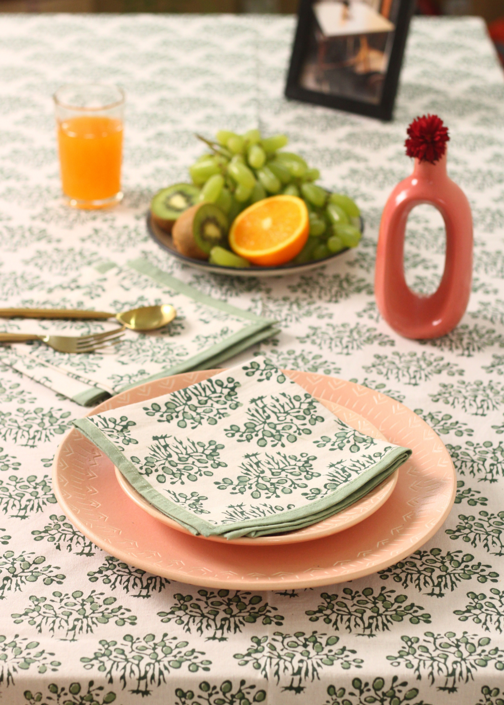 Banyan tree table napkin with dishes and fruits on it