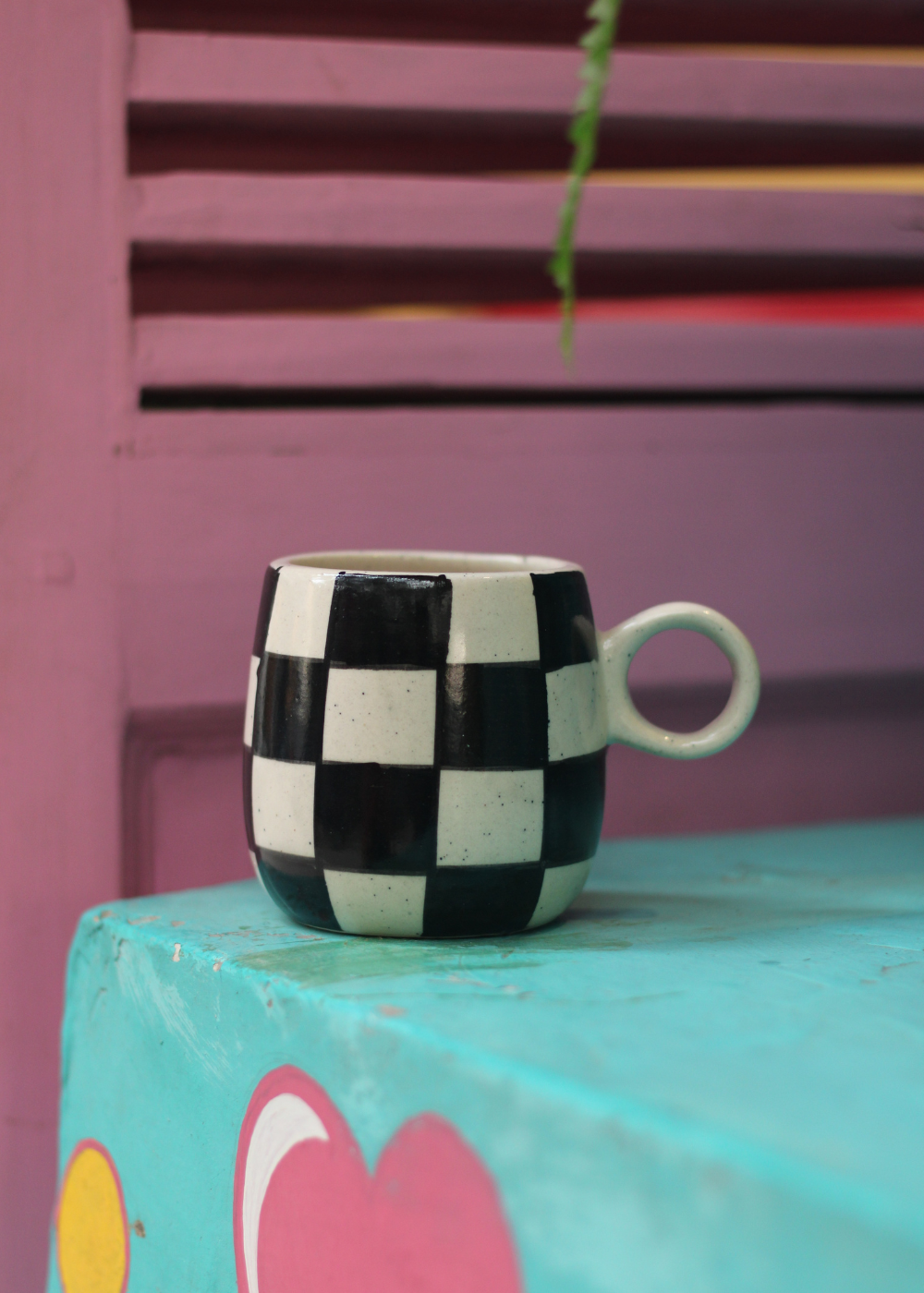 Black & white chess mug on table