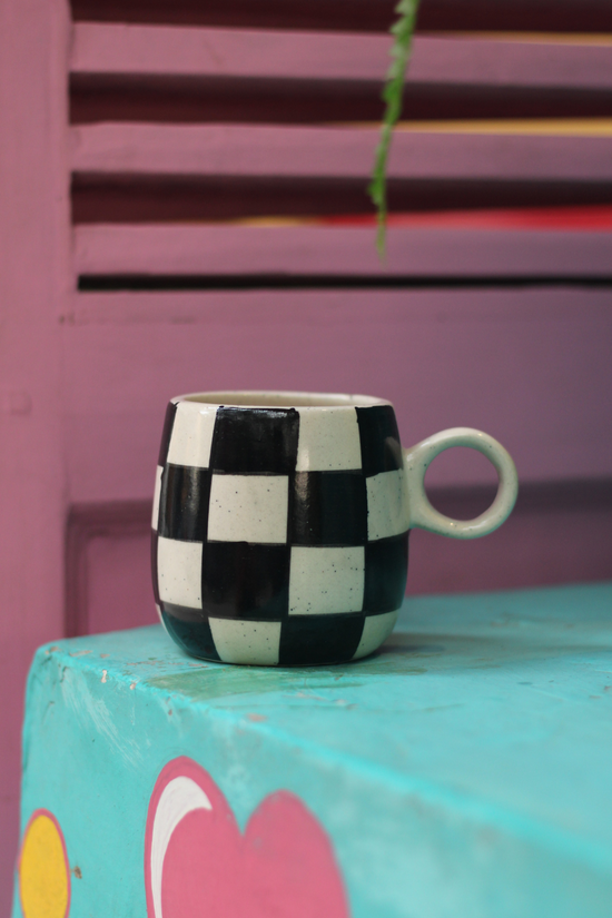 Black & white chess mug on table