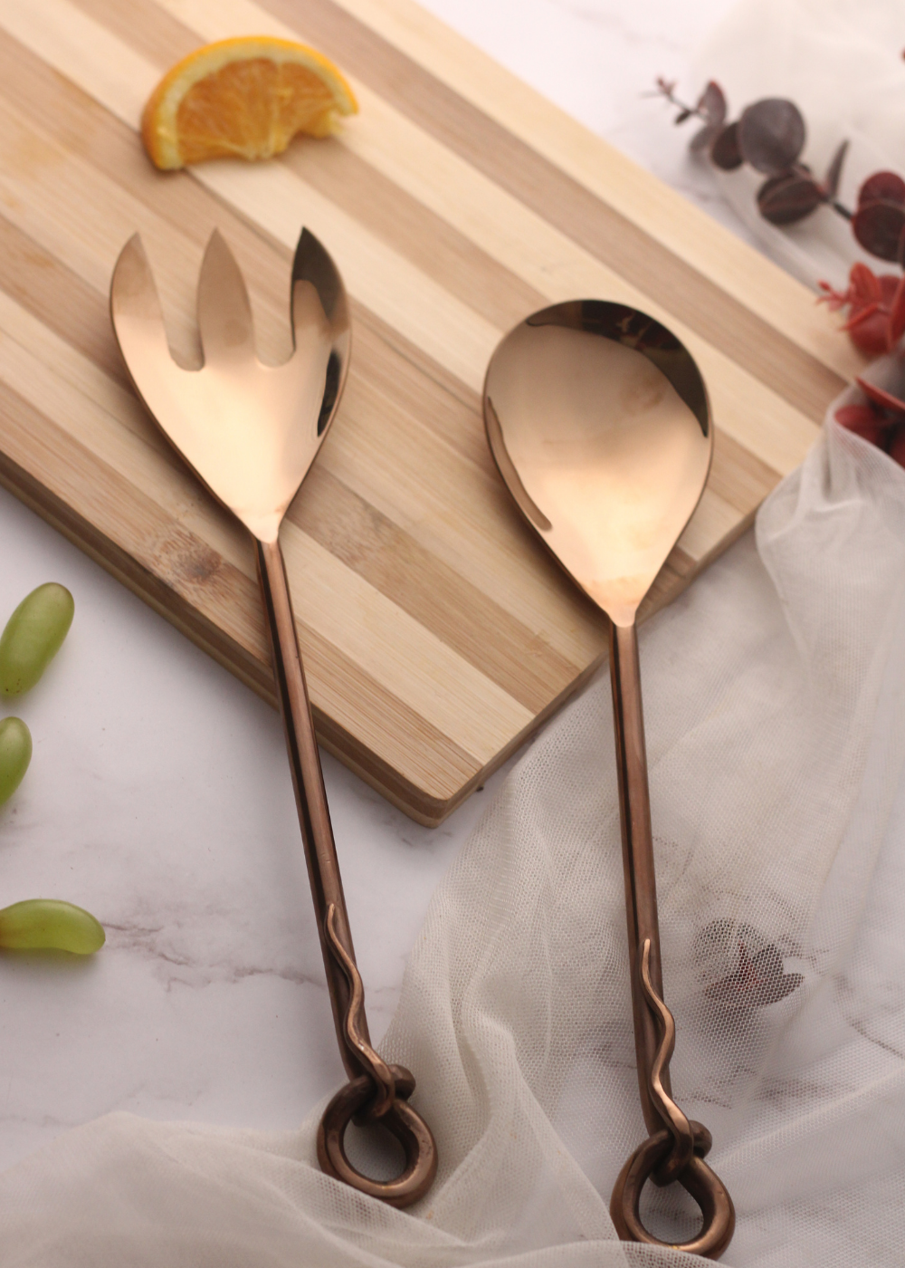 Bronze cutlery set on wooden surface