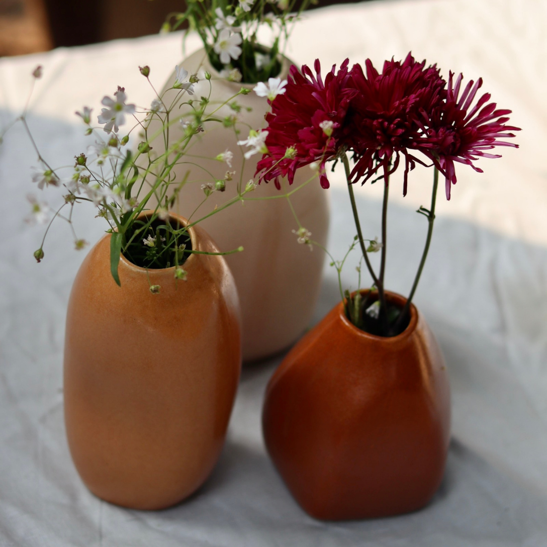 Ceramic little rust flower vase with flowers