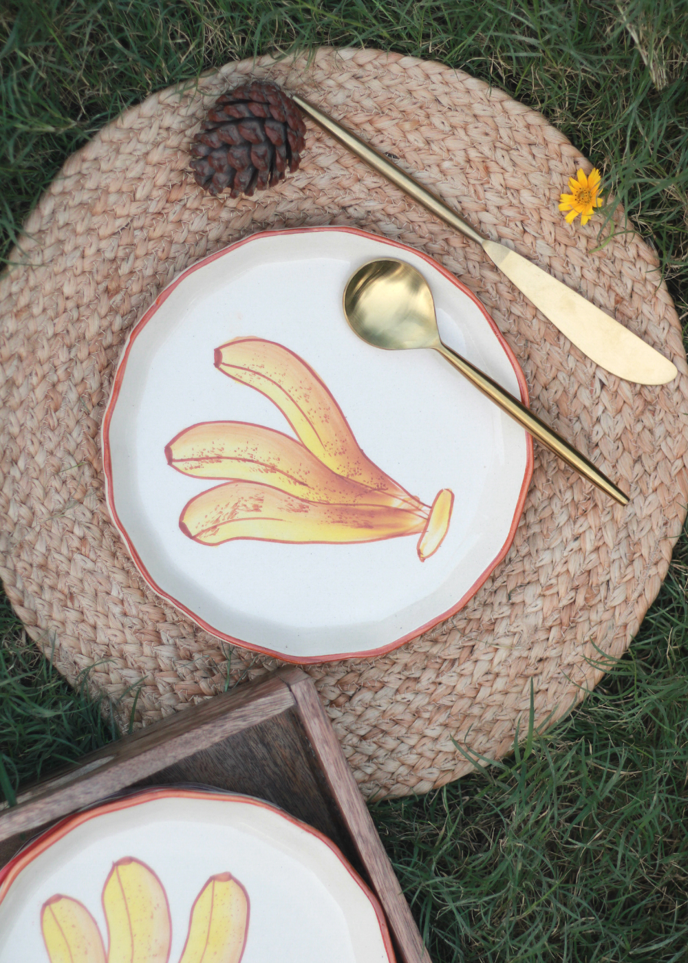Banana plate on a mat with cutleries