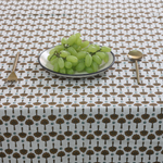 Floral table cloth with grapes and spoon