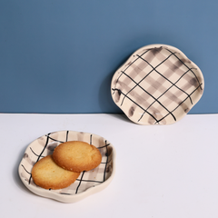 Checks handmade dessert plates with cookies