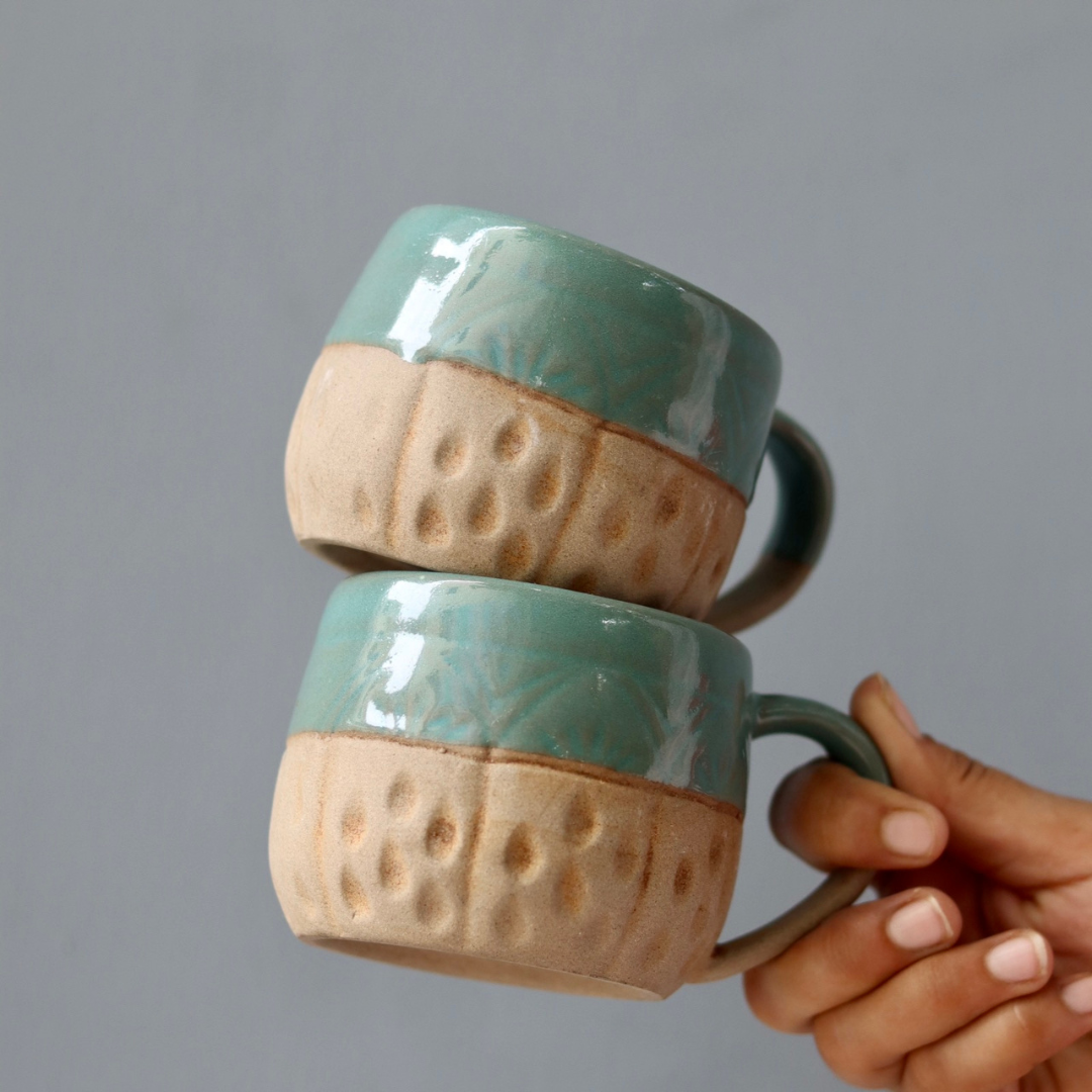 Brown and teal ceramic cups