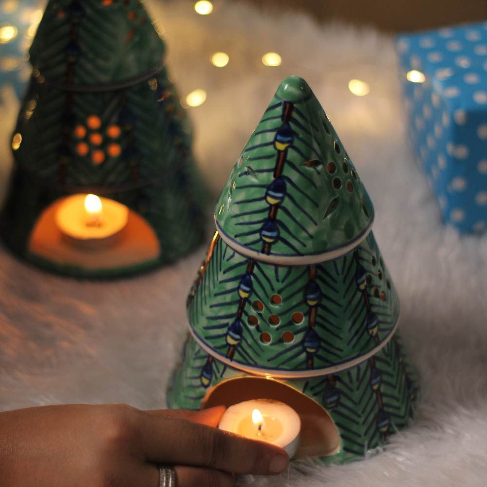 Christmas tree with candle in hand