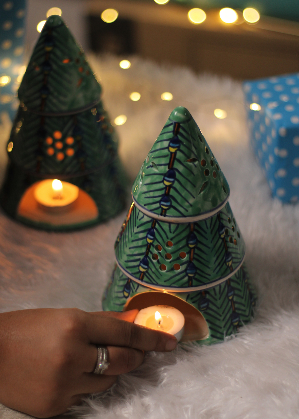 Christmas tree with candle in hand