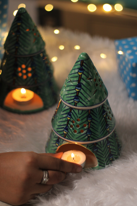 Christmas tree with candle in hand