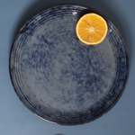 Grey spiral dinner plate with cutleries 