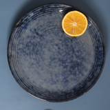 Grey spiral dinner plate with cutleries 
