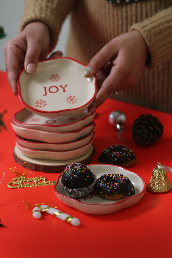 Ceramic dessert plates in hand