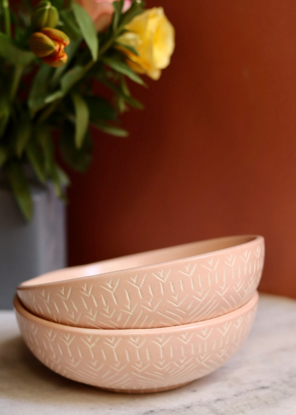 Blush pink carved salad bowls with flower vase